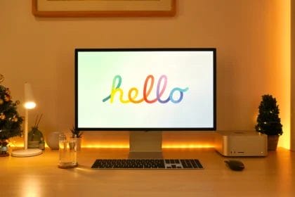 Apple Studio Desktop With Ambient Lighting And 'Hello' On Monitor