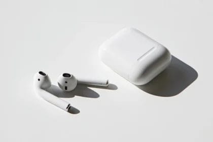 Apple Earpods And Airpods Side By Side On A Flat Surface.