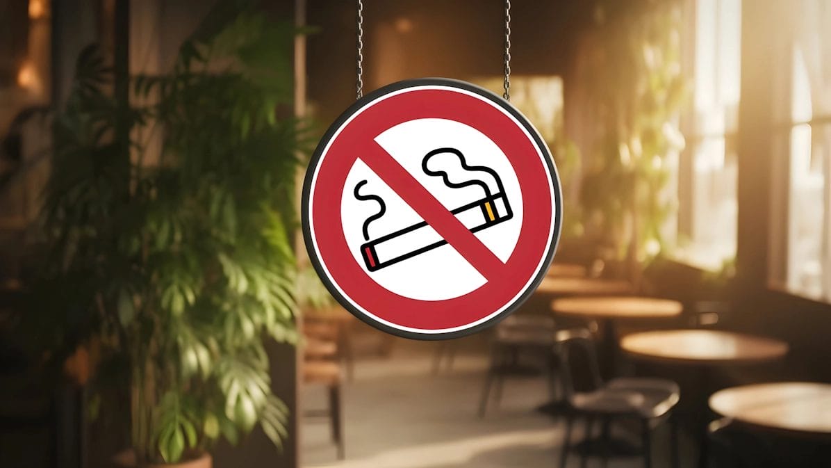 A No-Smoking Sign In A Cozy Café With Wooden Furniture.