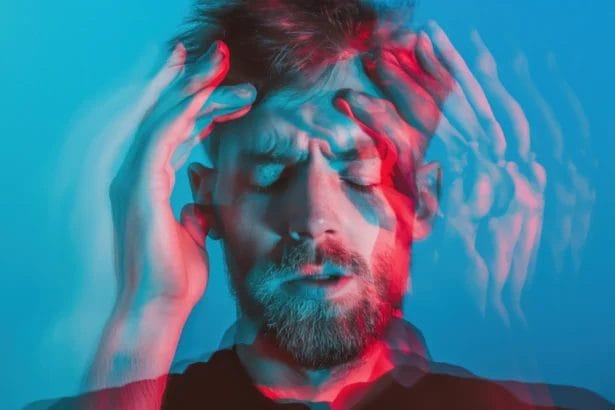 Man Holding His Head In Distress With Double Exposure Effect.