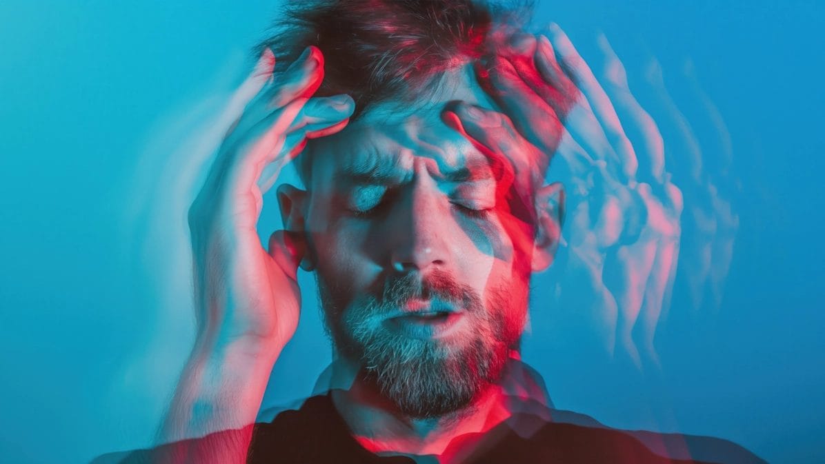 Man Holding His Head In Distress With Double Exposure Effect.